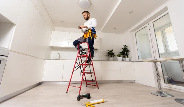 Portrait of young woman standing in factory