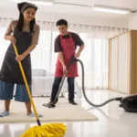 Happy asian young couple using vacuum cleaner and mop to clean home bedroom hygiene and health