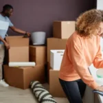 Young couple doing housework in the room